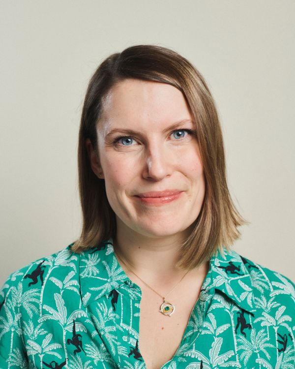 Portrait of Kayleigh against a plain background